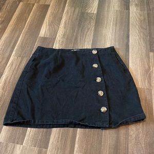 Black skirt with brown buttons